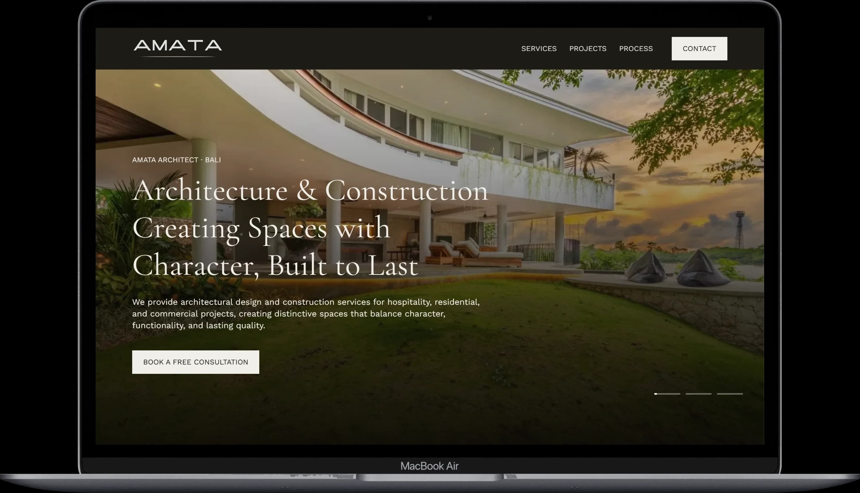 The Amata Architect homepage hero displayed on a laptop.